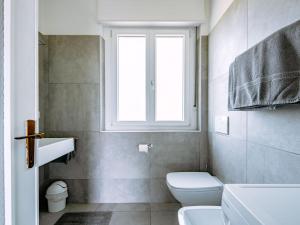 Koupelna v ubytování Holiday Home Villetta ai Pini-1 by Interhome