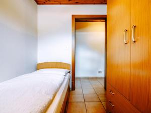 Posteľ alebo postele v izbe v ubytovaní Apartment Cincelli - Catinaccio by Interhome