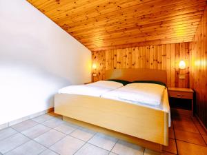 Posteľ alebo postele v izbe v ubytovaní Apartment Cincelli - Catinaccio by Interhome