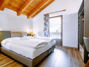 Posteľ alebo postele v izbe v ubytovaní Apartment Carmen-1 by Interhome