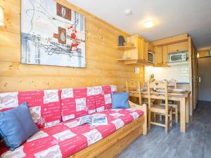 a living room with a couch and a table at Apartment Les Lauzières-3 by Interhome in Val Thorens