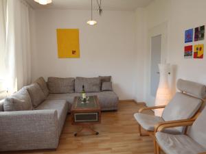 a living room with a couch and a table at Apartment Petra by Interhome in Nentershausen