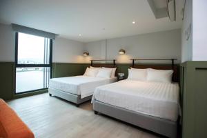 Postel nebo postele na pokoji v ubytování Monocolo Boutique Hotel