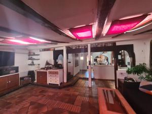 a living room with pink lights on the ceilings at Dúplex con Garaje en Malasaña in Madrid
