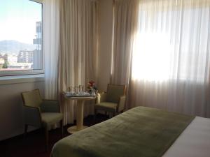 Posteľ alebo postele v izbe v ubytovaní Starhotels Cristallo Palace
