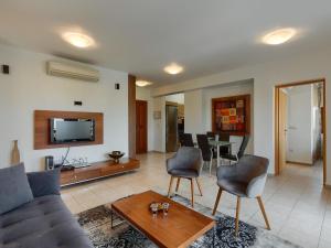 a living room with a couch and chairs and a table at Apartment Apartment Aphrodite Hills Golf by Interhome in Kouklia