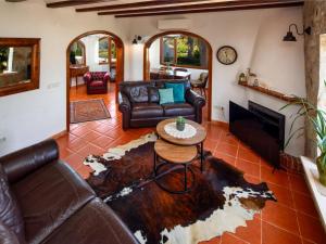 a living room with a couch and a table at Holiday Home Mabrouk by Interhome in Jávea