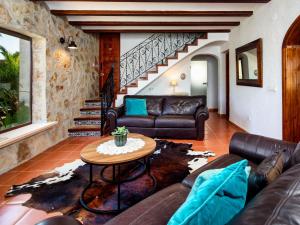 a living room with a couch and a table at Holiday Home Mabrouk by Interhome in Jávea