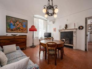 a living room with a table and a couch at Holiday Home Palazzo Mariscotti by Interhome in SantʼAndrea