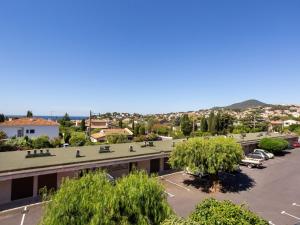 arial view of a building with a parking lot at Apartment Le Carthage by Interhome in Carqueiranne