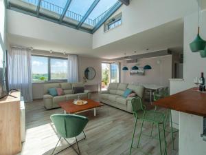 a living room with a couch and a table at Villa Futura by Interhome in Lorgnano +58 photos