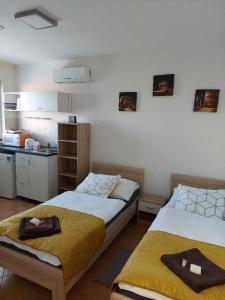En eller flere senger på et rom på Penzion Pohoda