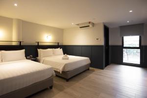 Postel nebo postele na pokoji v ubytování Monocolo Boutique Hotel
