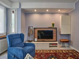 Télévision ou salle de divertissement dans l'établissement Apartment Nena & Vale by Interhome