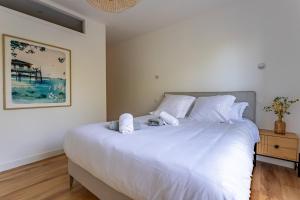 Llit o llits en una habitació de Pyla Plage - appartement vue mer - Perle(o)