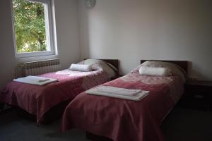 Letto o letti in una camera di Hotel Begić