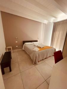 Postel nebo postele na pokoji v ubytování B&B Le Albare