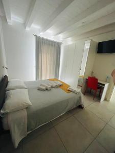 Postel nebo postele na pokoji v ubytování B&B Le Albare