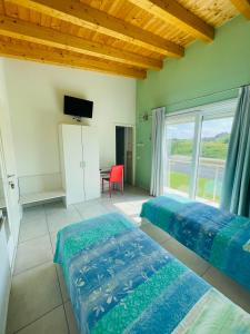 Postel nebo postele na pokoji v ubytování B&B Le Albare