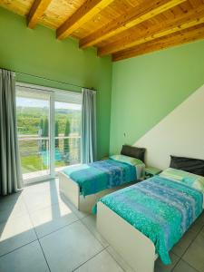 Postel nebo postele na pokoji v ubytování B&B Le Albare