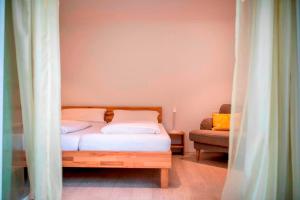 Cama o camas de una habitación en Naturhotel Holzwurm