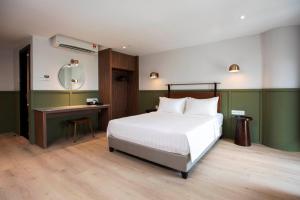 Postel nebo postele na pokoji v ubytování Monocolo Boutique Hotel