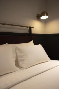 Postel nebo postele na pokoji v ubytování Monocolo Boutique Hotel