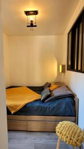 Cama o camas de una habitación en LES ORCHIDEES
