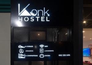 a sign for a kwk hospital on the side of a building at Konk Hostel in La Manga del Mar Menor