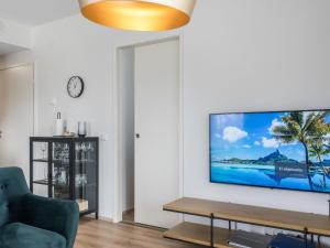 a living room with a flat screen tv on a wall at Holiday Home Alakuuntie 2- as-17 by Interhome in Sirkka