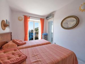 Posteľ alebo postele v izbe v ubytovaní Villa Il Corallo by Interhome