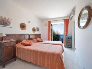 Posteľ alebo postele v izbe v ubytovaní Villa Il Corallo by Interhome