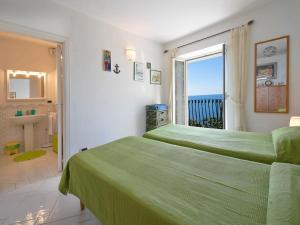 Posteľ alebo postele v izbe v ubytovaní Villa Il Corallo by Interhome