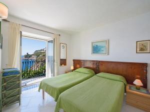 Posteľ alebo postele v izbe v ubytovaní Villa Il Corallo by Interhome