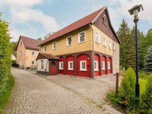 a large house with red doors and a cob at Holiday Home Dunja by Interhome in Hain