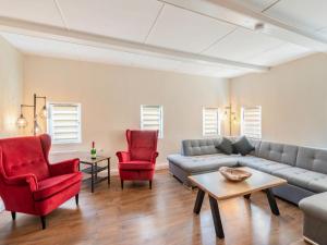 a living room with a couch and two chairs at Holiday Home Dunja by Interhome in Hain