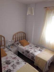 Una cama o camas en una habitación de El Ancla