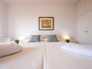 Postelja oz. postelje v sobi nastanitve Holiday Home Cantamar by Interhome