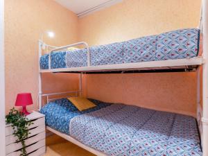 Posteľ alebo postele v izbe v ubytovaní Apartment Victoria Surf-13 by Interhome