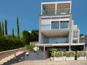 an apartment building with a staircase in front of it at Apartment Deluxe Bellissima by Interhome in Crikvenica