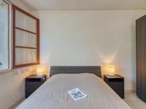 Łóżko lub łóżka w pokoju w obiekcie Holiday Home Dominique by Interhome