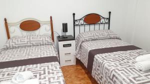 A bed or beds in a room at CHILLOUT LA RIOJA
