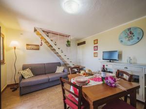 a living room with a couch and a dining room table at Holiday Home Il Nido by Interhome in Culla