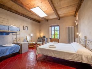 a bedroom with a large white bed in a room at Apartment L'appartamento del Monastero by Interhome in Dronero