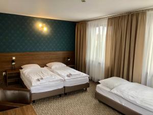 Posteľ alebo postele v izbe v ubytovaní Hotel Krystyna
