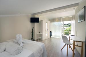 Postel nebo postele na pokoji v ubytování Nasilvana Hotel & Spa Adults Only