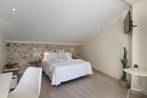 Postel nebo postele na pokoji v ubytování Nasilvana Hotel & Spa Adults Only
