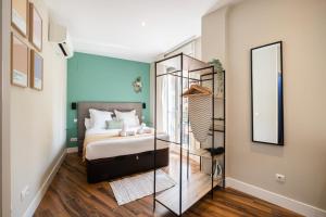 A bed or beds in a room at Apartamentos Cruz