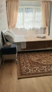 Krevet ili kreveti u jedinici u okviru objekta Уютная трешка в центре Алматы