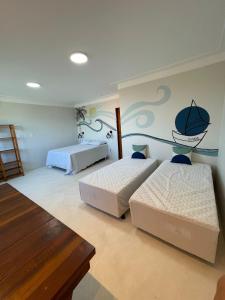 a bedroom with two beds in a room at Sunshine - Casa de praia em Barra Grande -Ba in Barra Grande